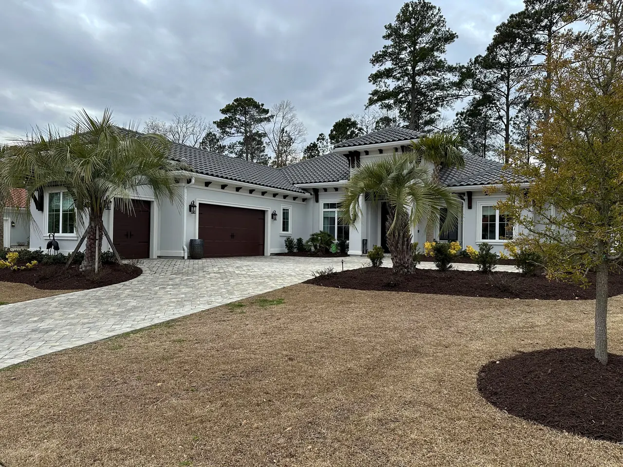 Clean driveway and a maintained lawn at a local property.